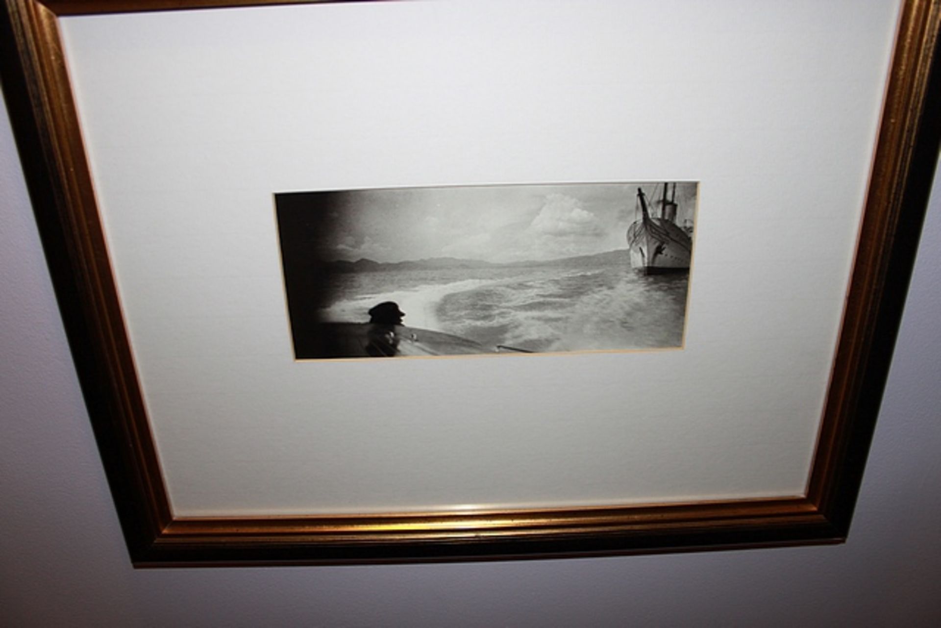 A pair of black and white photoprints, golf and a boat at sea framed 540mm x 410mm with brass - Image 2 of 2