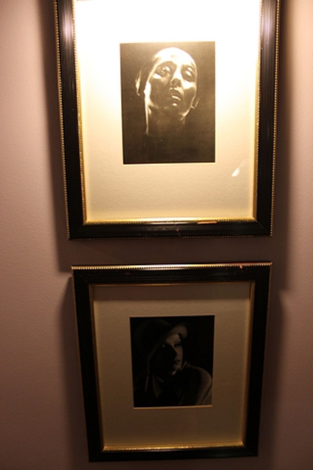 A pair of black and white photoprints, film stars framed 400mm x 475mm with brass picture lamp