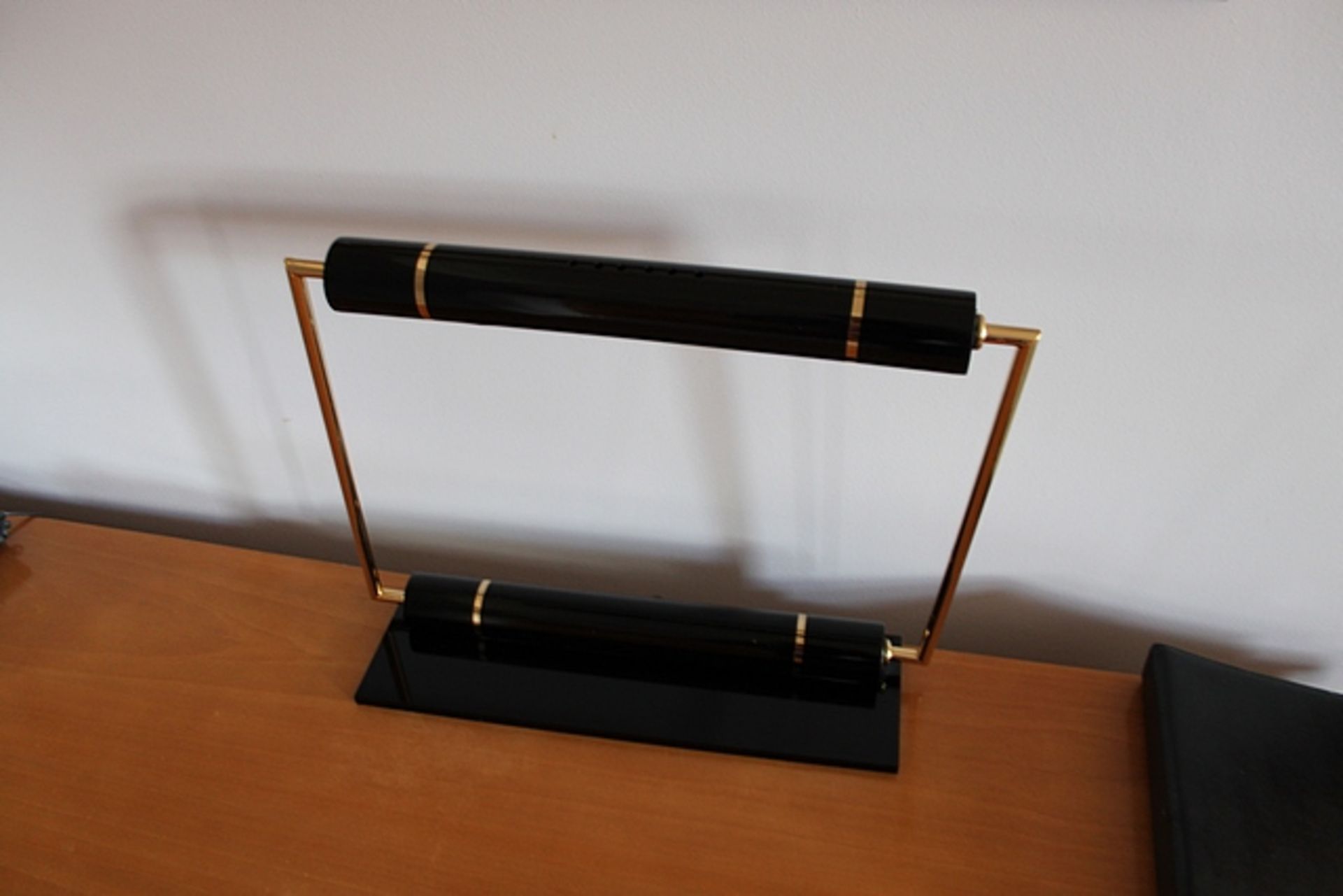 A contemporary square bankers style lamp resin and brass finish 490mm