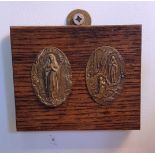 Two Lourdes Medallions mounted on oak picture block