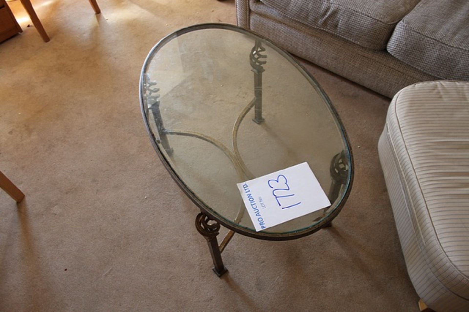 Oval glass top wrought metal framed coffee table 1000mm x 490mm