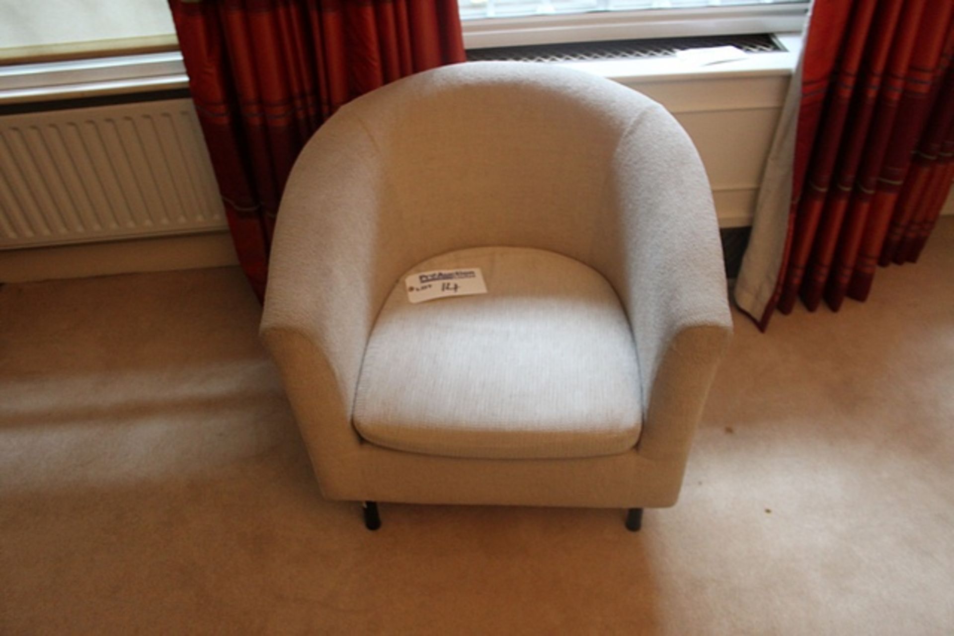 An upholstered tub chair