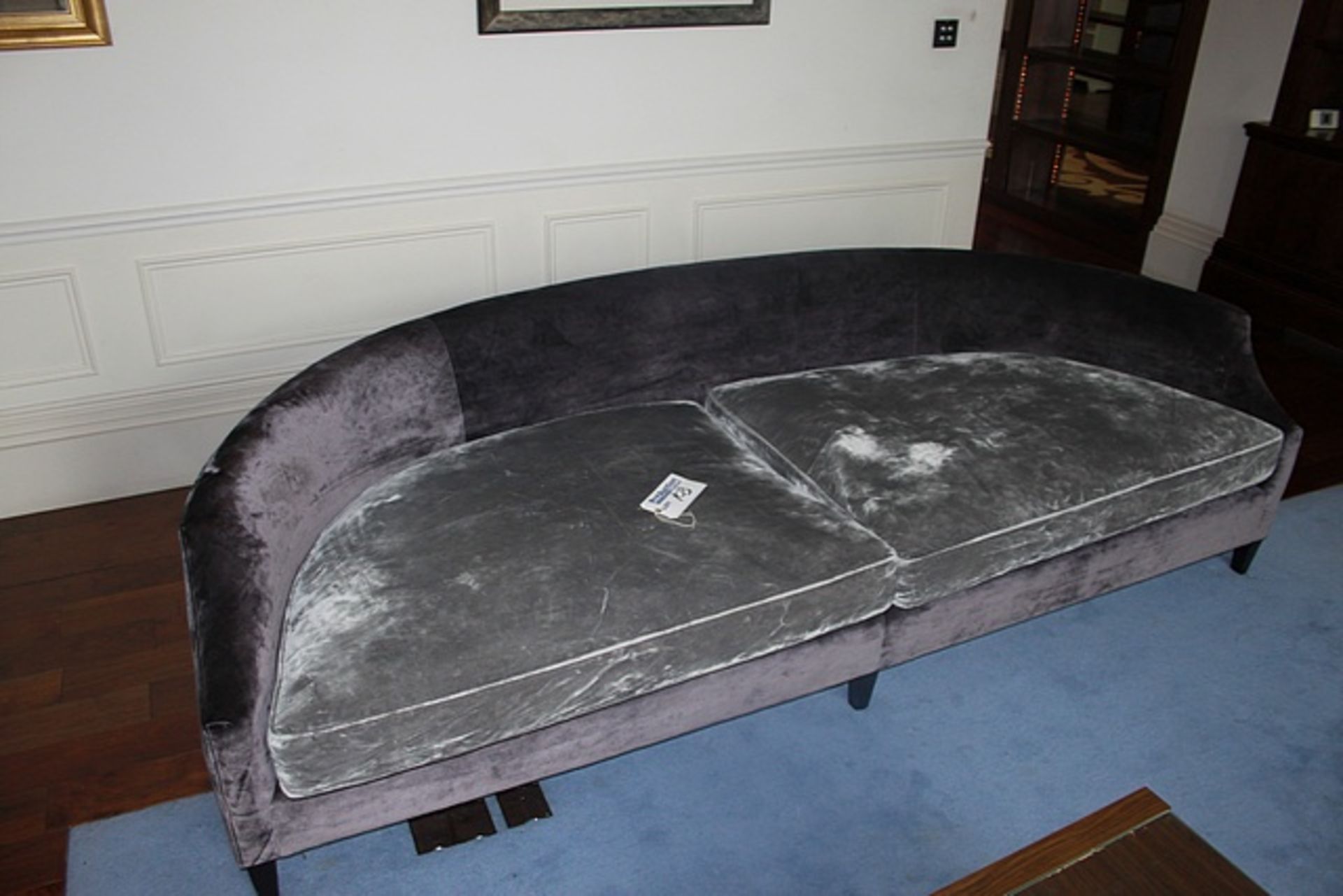 Elegant curved designer sofa , this multi tone curved sofa is uniquely upholstered in velvet with