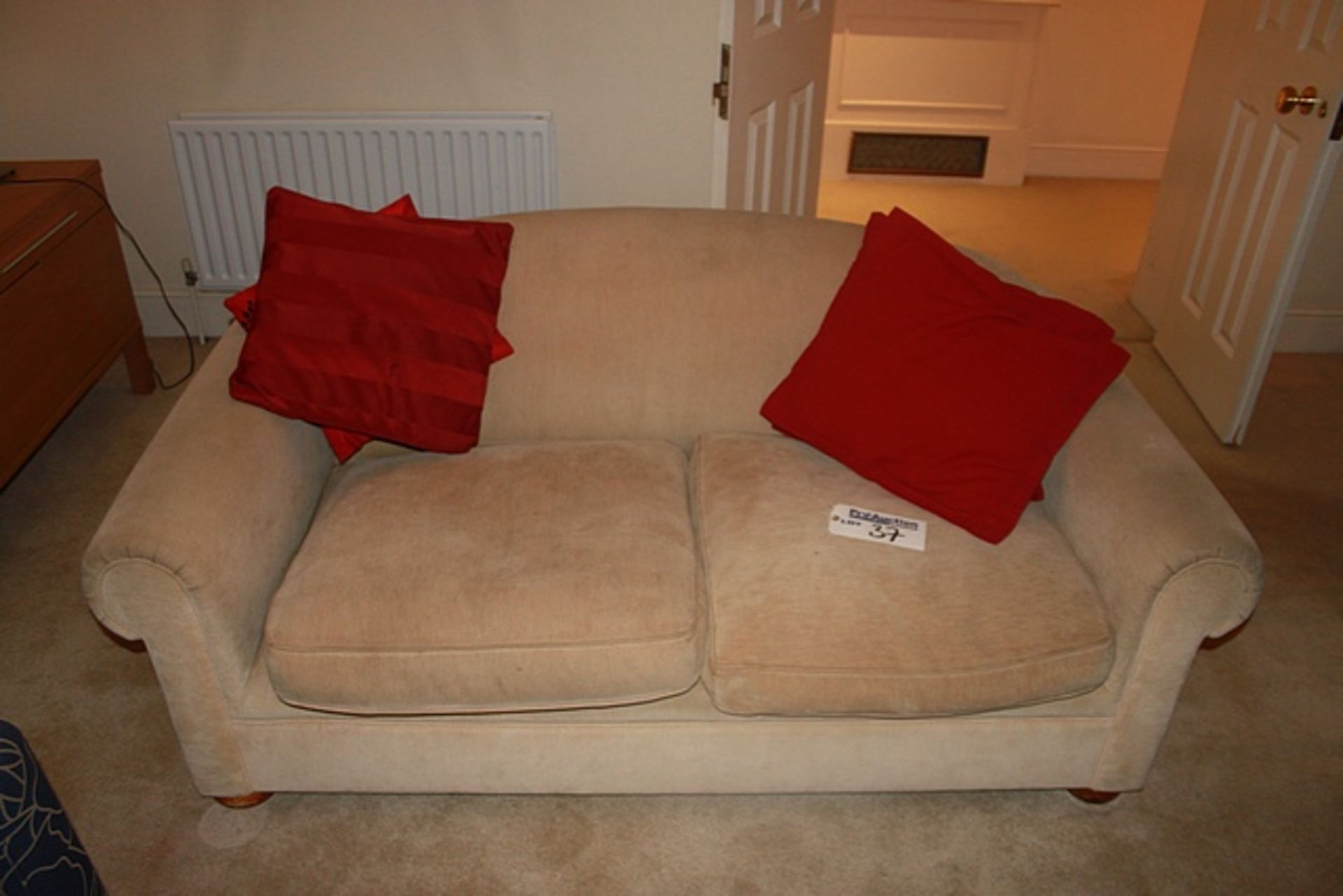 Cream upholstered two seater sofa 1700mm x 900mm