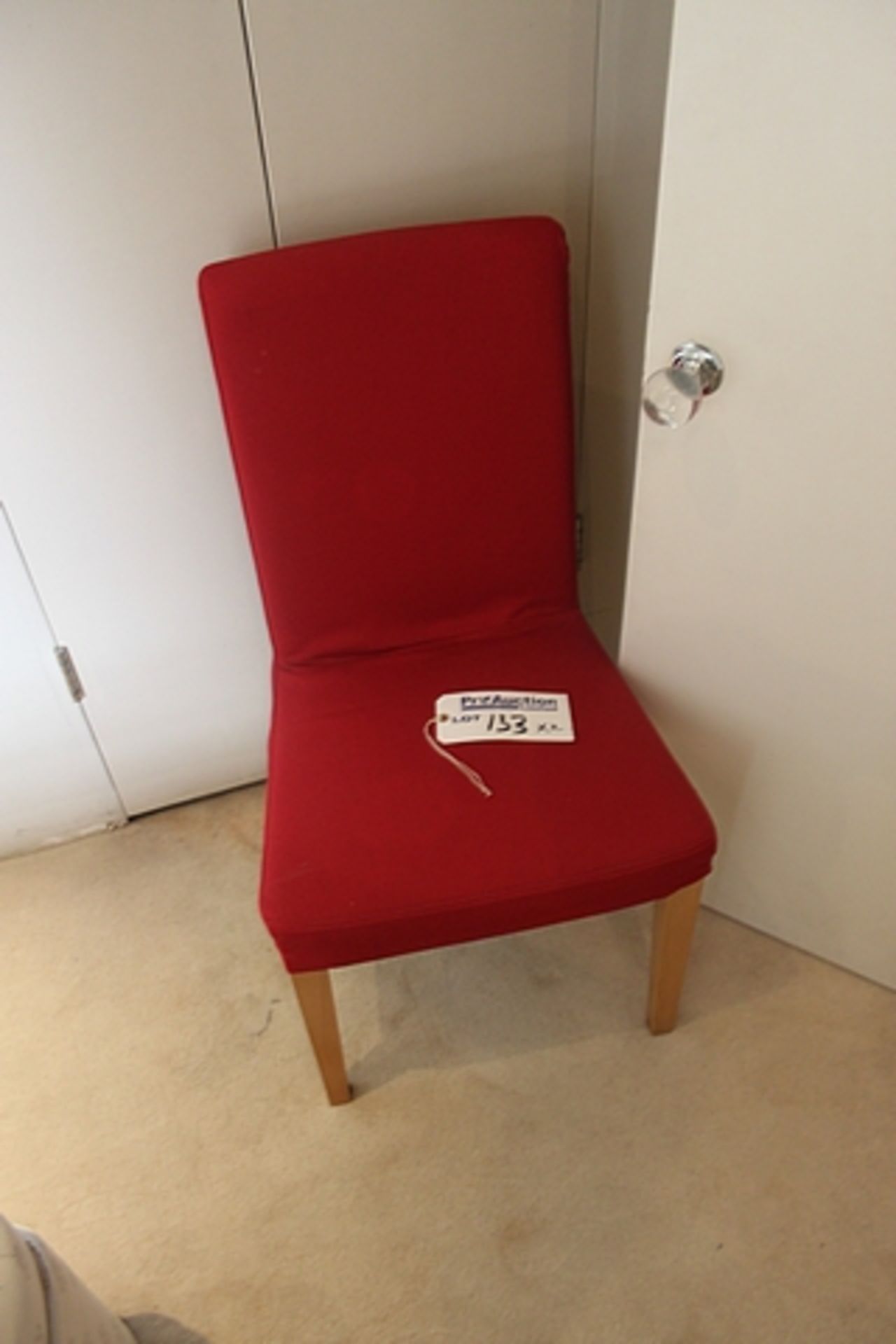 A pair of side chairs with red slip cover