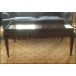 A mahogany tray top style coffee table mounted on square legs Room108Lift out charge 10