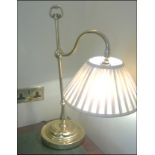 A pair of shaped table lamp and a brass swan neck table lamp Room109Lift out charge 5