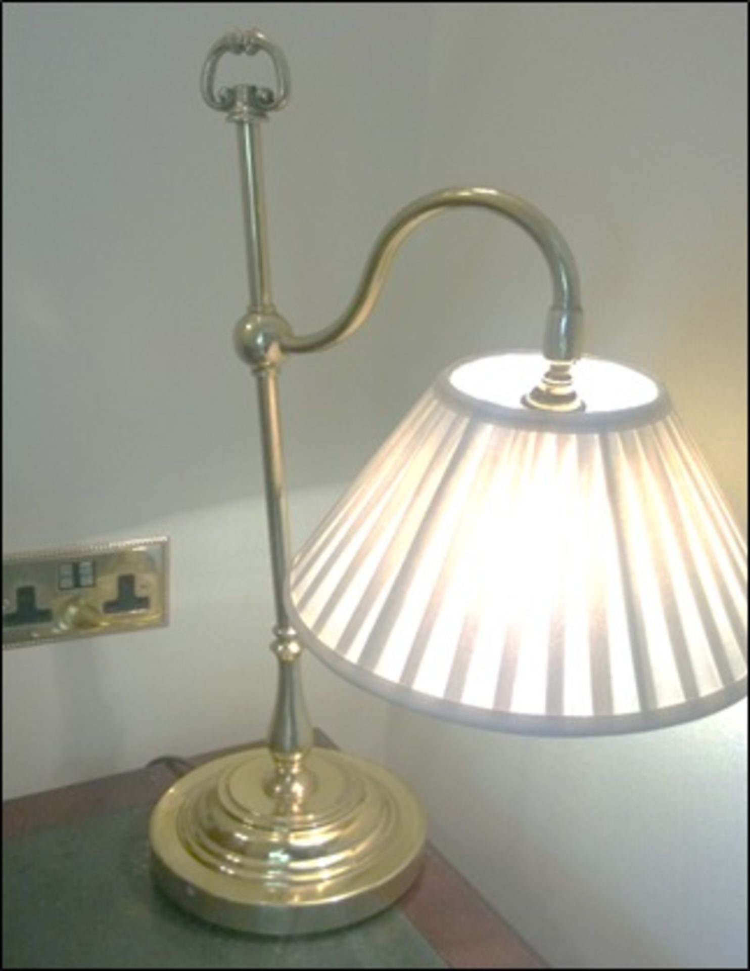 A pair of shaped table lamp and a brass swan neck table lamp Room109Lift out charge 5