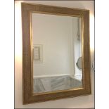 A gilt ornate framed wall mirror Room107Lift out charge 10