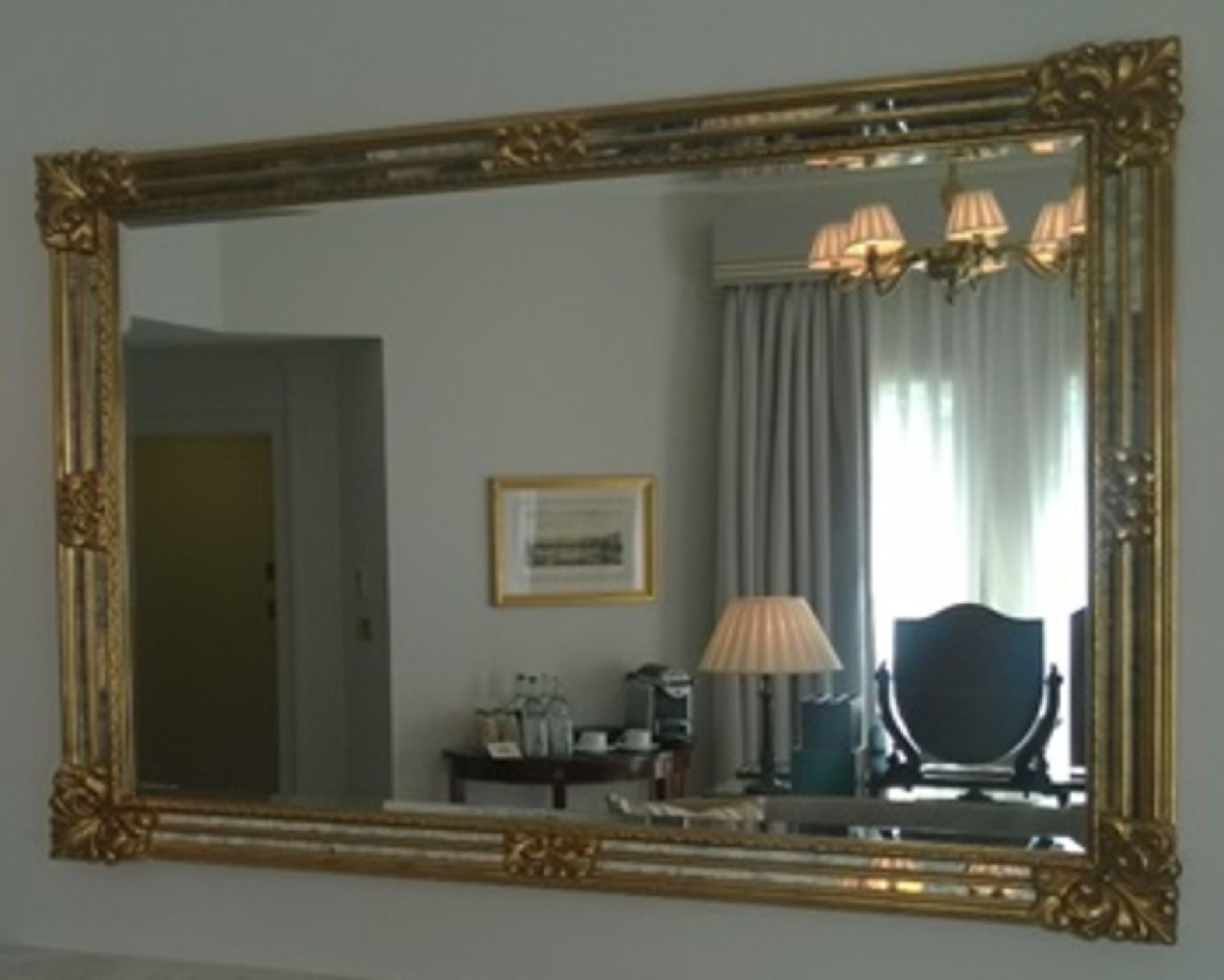 A carved framed rectangular over mantle mirror ornately decorated frame Room107Lift out charge 10