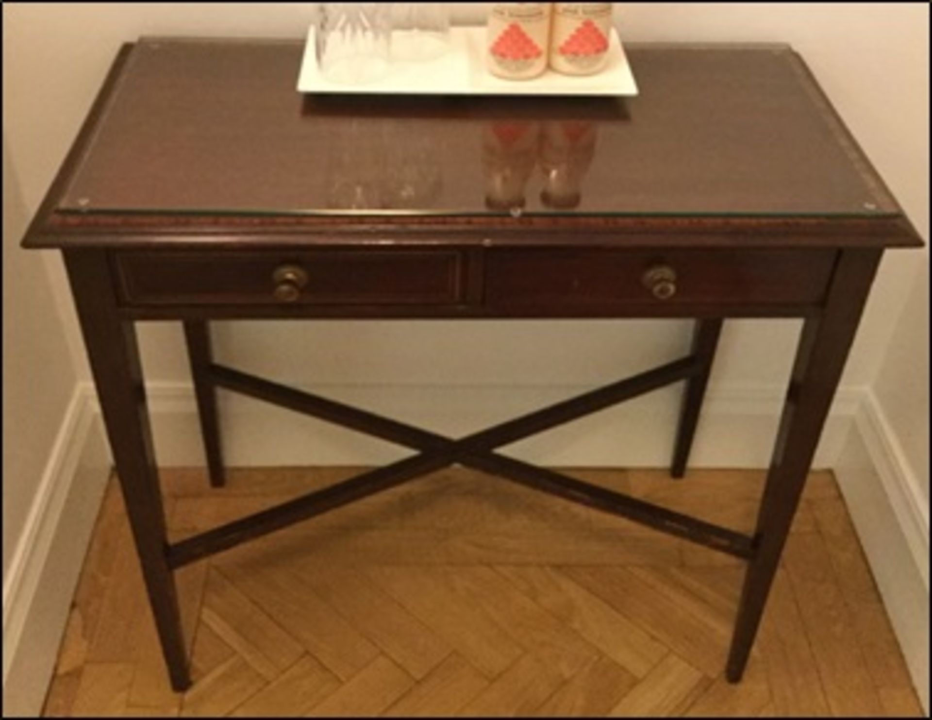 A Georgian style sofa table with two central frieze drawers on square end supports with central