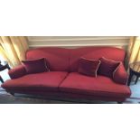 A camel back upholstered sofa mounted on front castor legs Room107Lift out charge 30