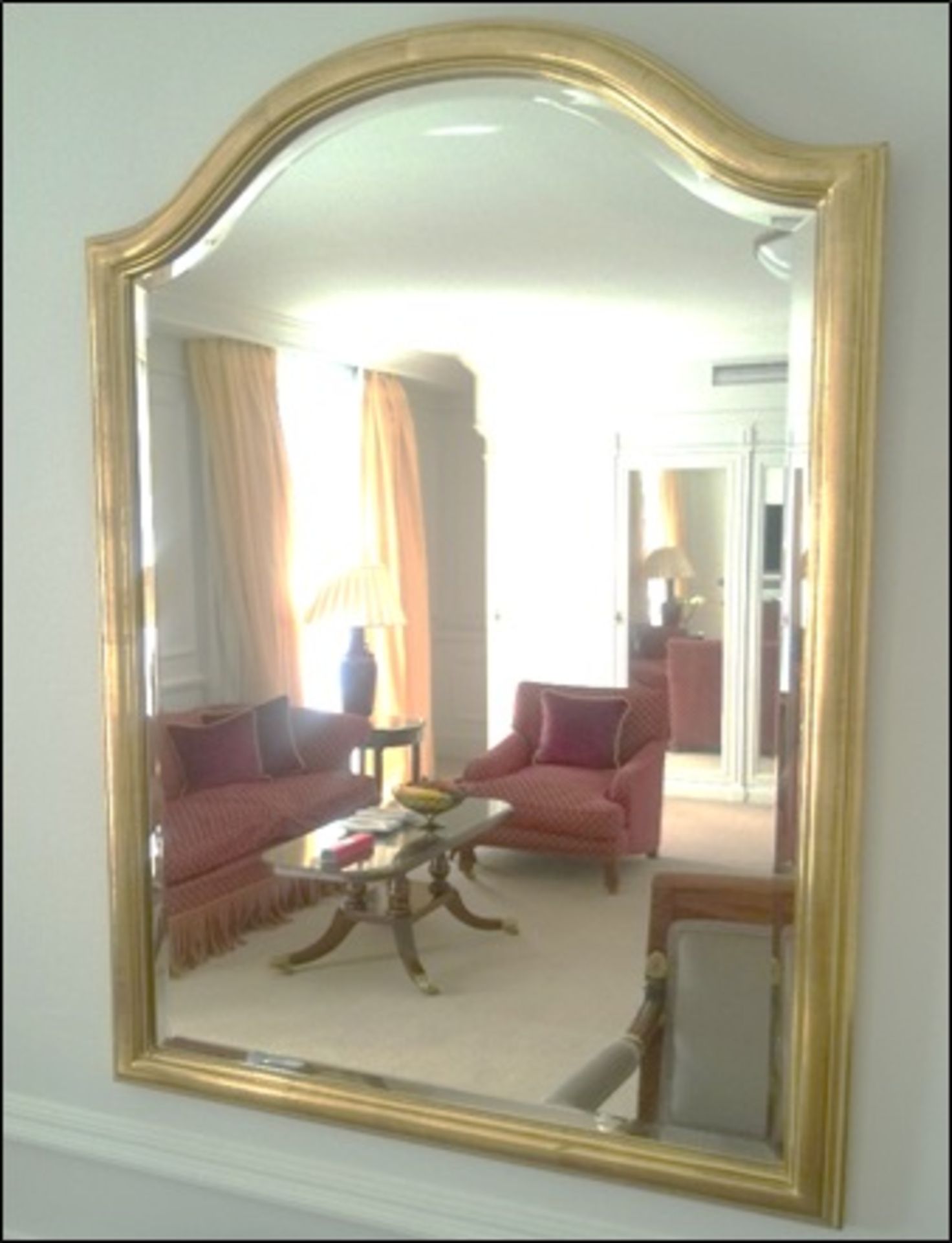 A Venetian shaped gilt framed wall mirror Room912Lift out charge 5
