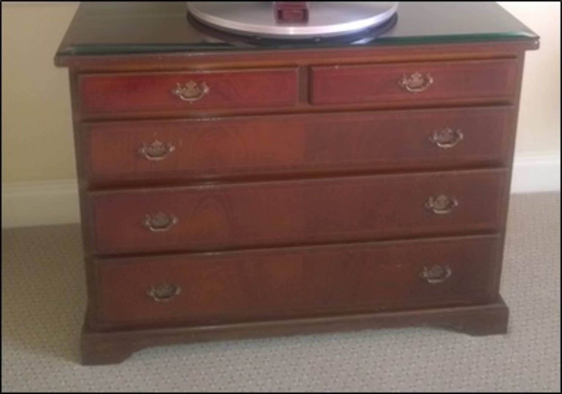 A mahogany chest of drawers with three full two half drawers on bracket plinth Room107Lift out