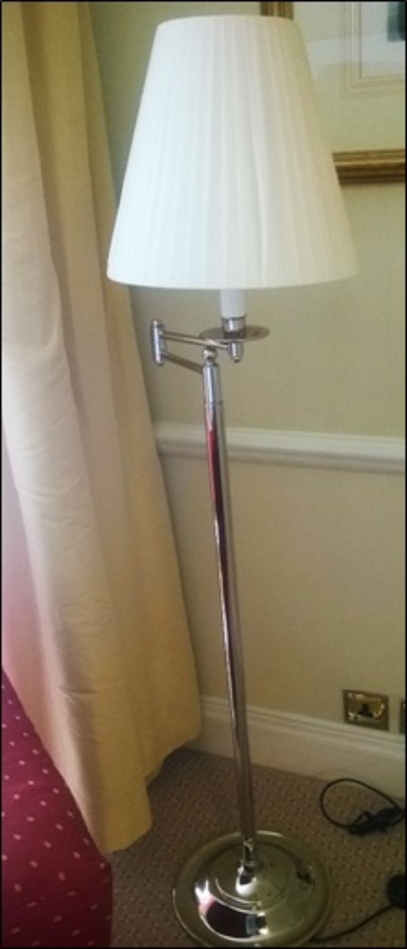 A silver metal swing arm floor standing lamp with shade Room110Lift out charge 5