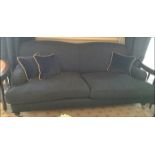 A contemporary curved back upholstered sofa with front castor legs Room108Lift out charge 30