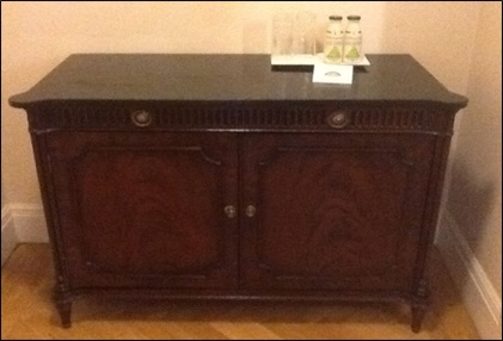 A mahogany two door chest with shaped top frieze drawers to apronRoom108Lift out charge 10