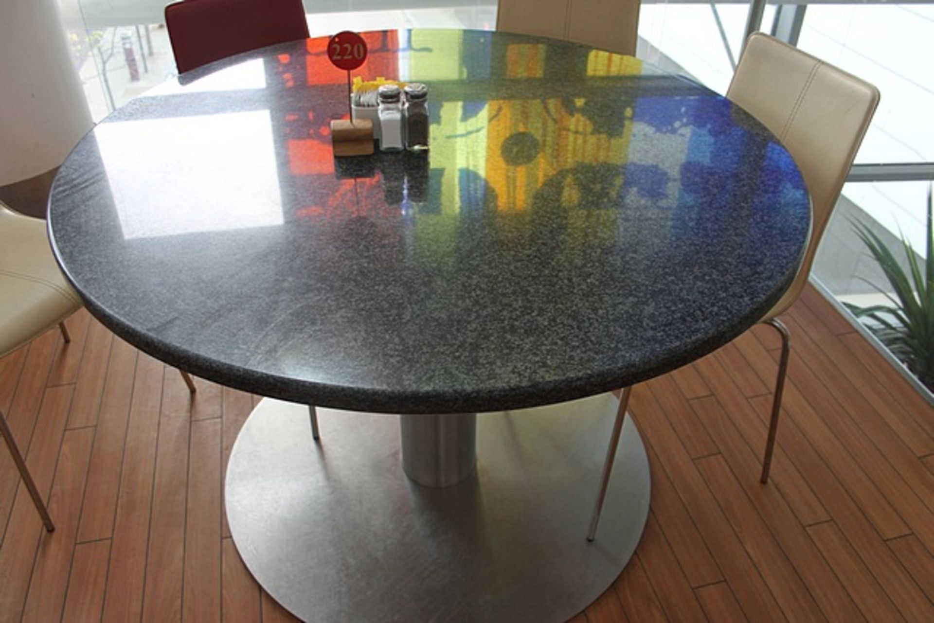Circular Granite stone restaurant table1200mm diameter on steel pedestal base 800mm tall