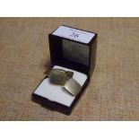 A pair of 14ct gold cufflinks, square and engine turned on a fixed arm 9.5 grams