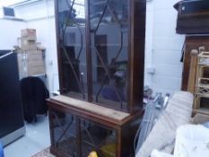 A George III mahogany astragal-glazed bookcase cabinet, the upper section with a shallow cornice