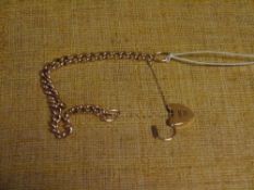 A 9ct gold curb link bracelet, with heart padlock clasp. 20 grams