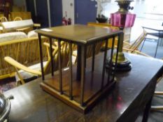 An Edwardian mahogany desk top revolving bookcase. 30cm by 28cm square