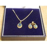 A suite of 9ct gold topaz jewellery comprising pendant and pair of drop earrings