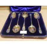 A cased set of George III Irish silver-gilt berry spoons, Dublin 1809, the four associated sifting