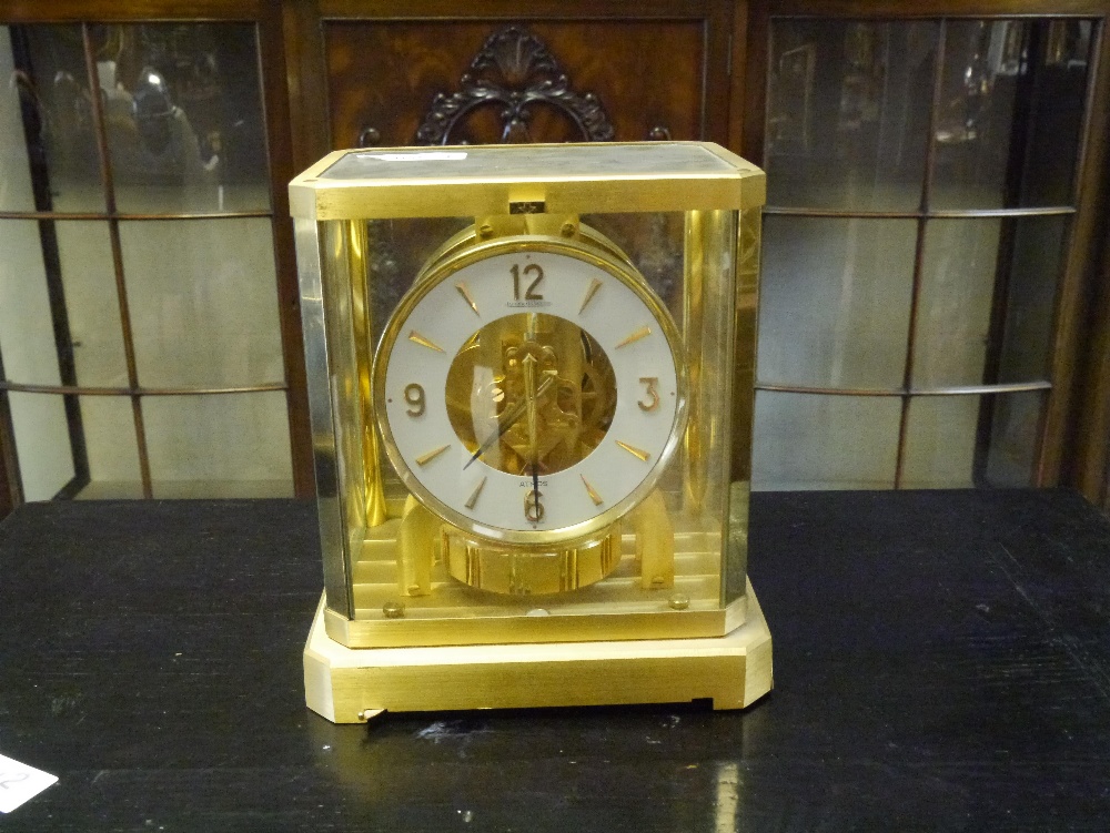 A Jaeger-le-Coultre Atmos clock, 20th century, the white chapter ring with Arabic and dagger