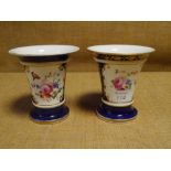 A pair of porcelain vases, c. 1830, in the manner of Coalport, each painted with a floral spray in a