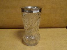 An early 20th century silver-mounted cut-glass vase, the vase elaborately cut and of inverted