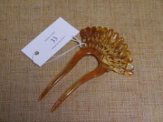 A lady's decorative hair comb, finely decorated with "coronet" surmount, on a twin prong comb. 12.