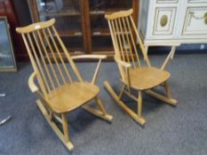 An pair of Ercol light elm rocking chairs