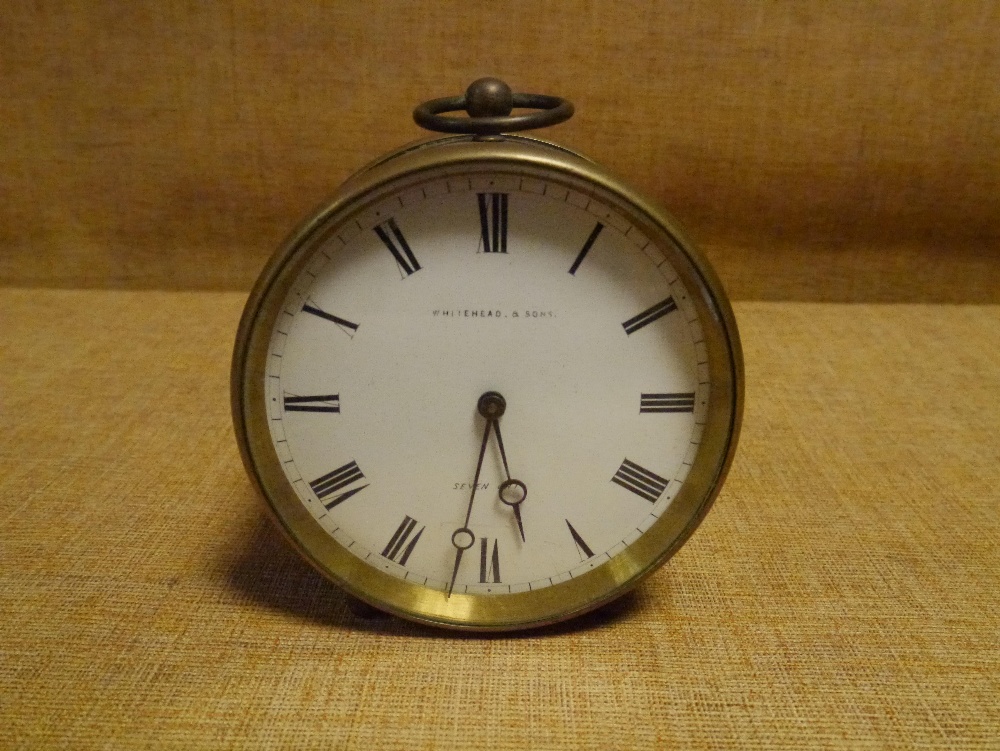 A late 19th century French brass drumhead desk clock, the white enamel dial with Roman numerals