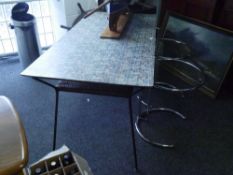 A late 1950's formica topped work or dining table, of Kandya type, with brick effect patterned