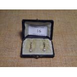 A pair of Continental 14ct gold seed pearl drop earrings, with hoop fittings. Length c. 27mm