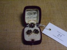 A 9ct gold garnet cluster ring, together with a pair of stud earrings en suite