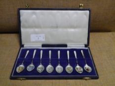 A cased set of eight floral enamel and silver teaspoons, Cohen & Charles, Birmingham 1967, each bowl