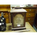 An early 20th century mahogany cased bracket clock, the case with caddy top and raised on bracket
