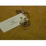 An Edwardian 9ct gold amethyst and seed pearl pendant, on a 9ct ropetwist chain with barrel clasp.