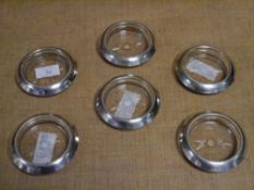 A set of six American sterling silver-mounted cut-glass butter dishes, each with beaded collar and