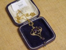 A 9ct gold Edwardian amethyst and seed pearl pendant in the Art Nouveau taste, set with a round-