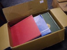 Box containing nine various stamp albums and a mixture of stamps