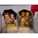 A pair of Goebel porcelain figure groups, Disney 50th anniversary, Mickey and Minnie and Rainy