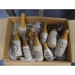 Box containing a large collection of ginger beer bottles including Kellys of Edinburgh dumpy bottle,