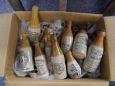 Box containing a large collection of ginger beer bottles including Kellys of Edinburgh dumpy bottle,