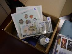 Box containing a group of British currency including banknotes, Churchill Jubilee crowns, Queen