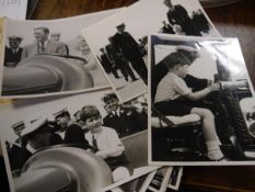 A group of black and white photographs of a visit to HM The Queen, Prince Charles and Princess