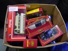Box containing a collection of Corgi die cast models including Hamleys finest toy shop bus, double