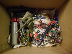 Box containing a collection of toy painted metal soldiers including Queens Guard, jousting